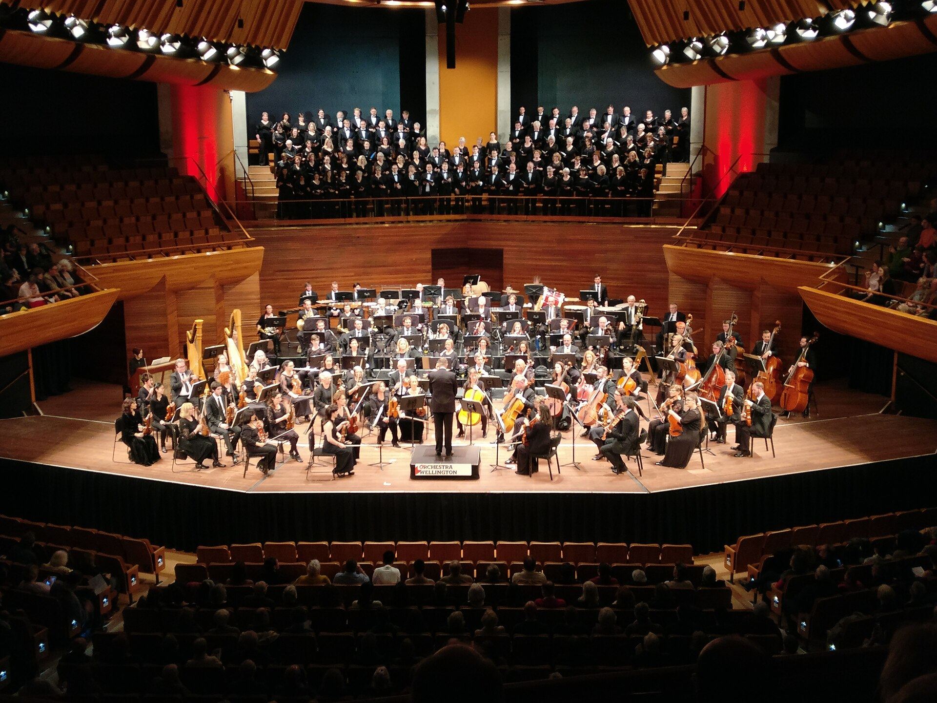 An orchestra performing in a concert hall